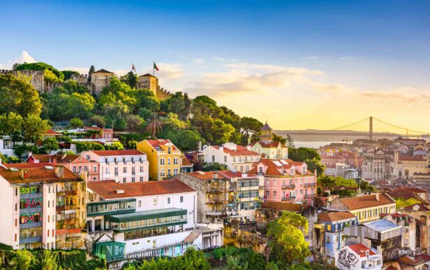 Lisbon, Portugal old town cityscape at dusk.